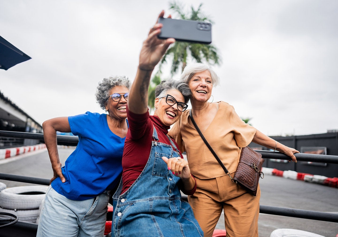 3 people taking a selfie