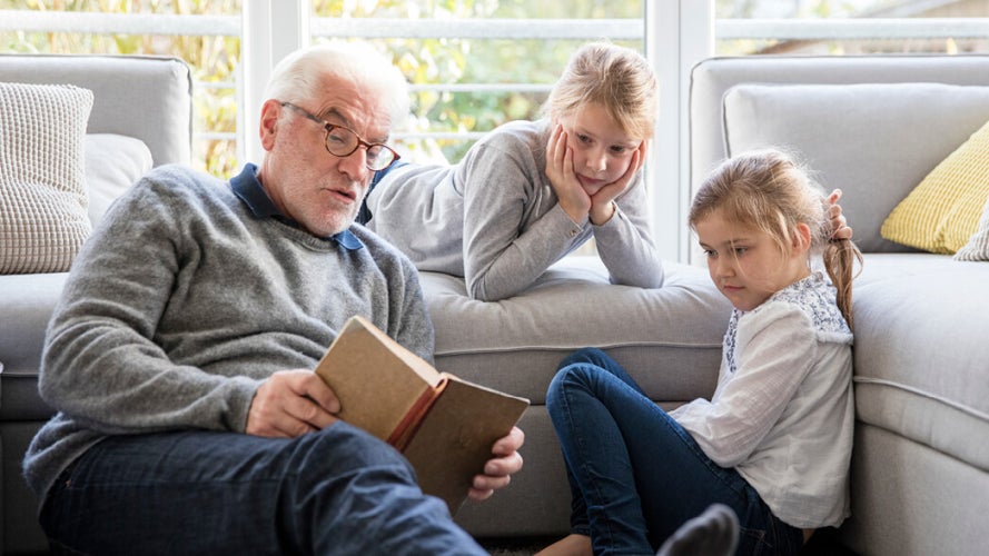 Grandparent reading to grandchildren