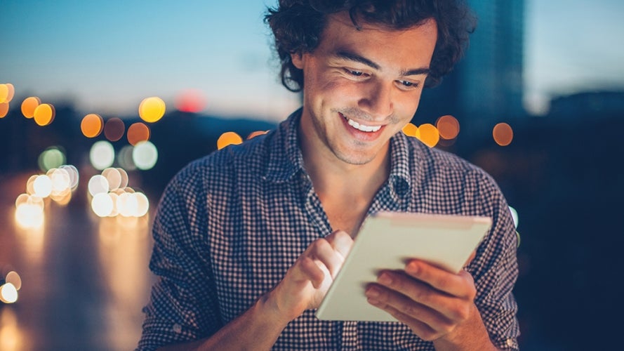 Person using tablet at night