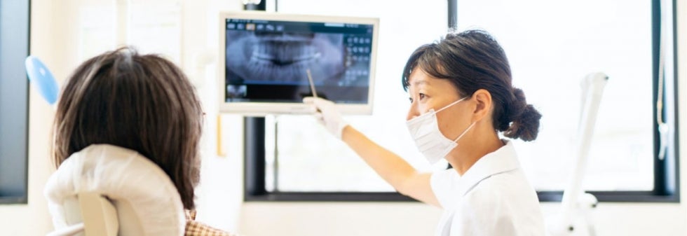 Dentist showing an xray to a patient