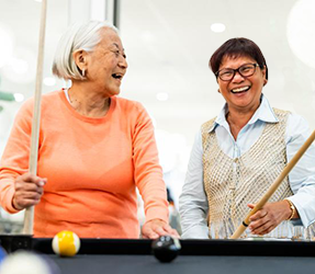 Two people playing pool