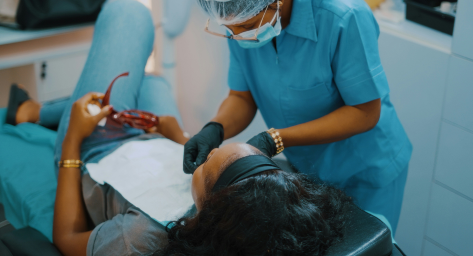 women in dentist chair getting an evaluation
