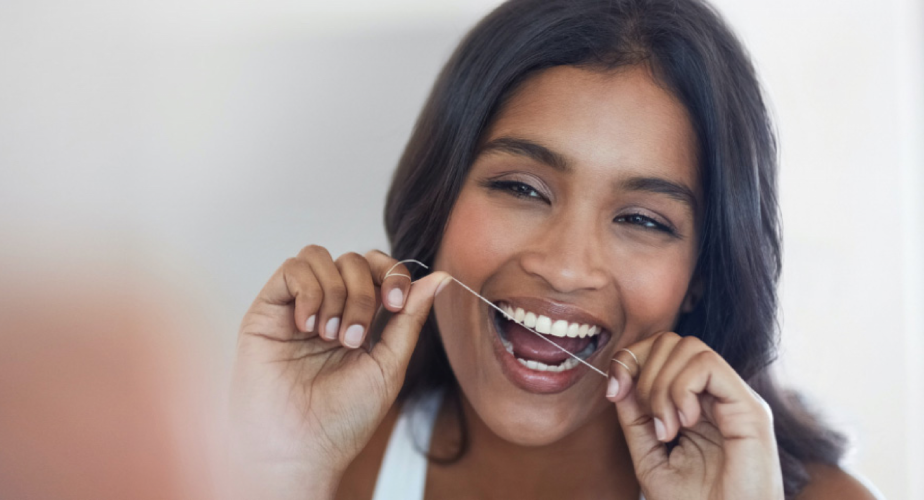 Woman flossing