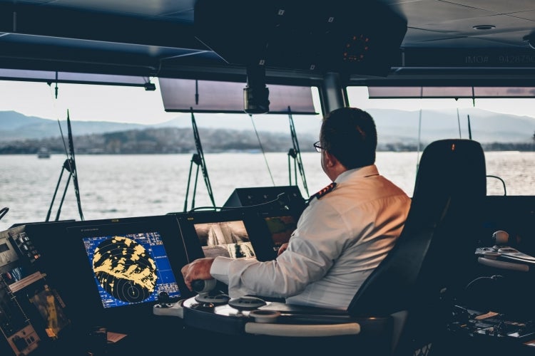 Person piloting a ship
