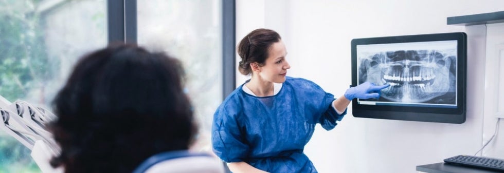 Dentist examining xray