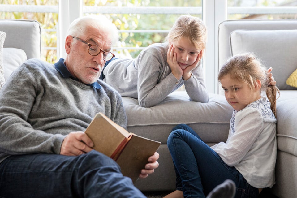 Grandparent reading to grandchildren