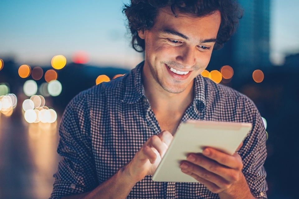 Person using tablet at night