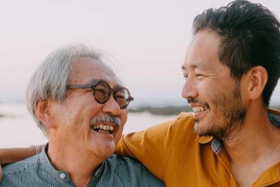 Father and son smiling