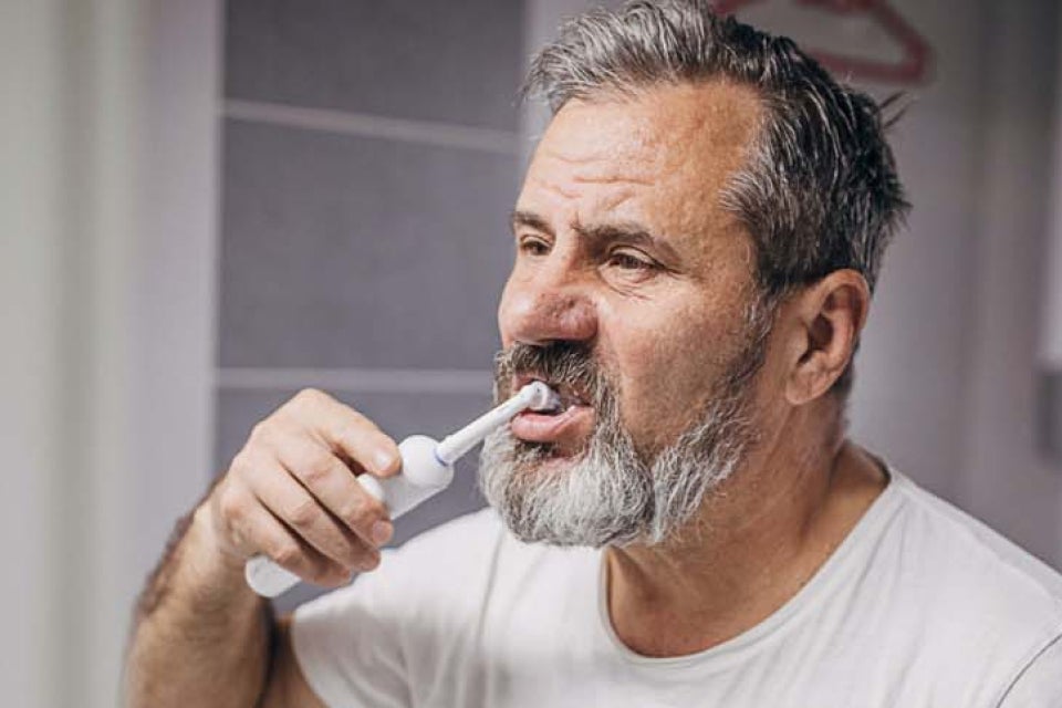 Man brushing teeth