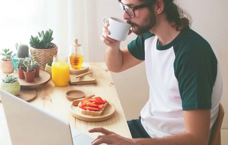 Person drinking coffee at table