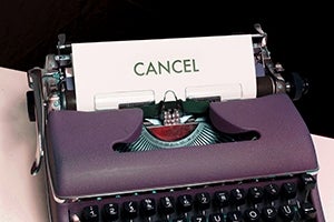 Typewriter with the message Cancel on it
