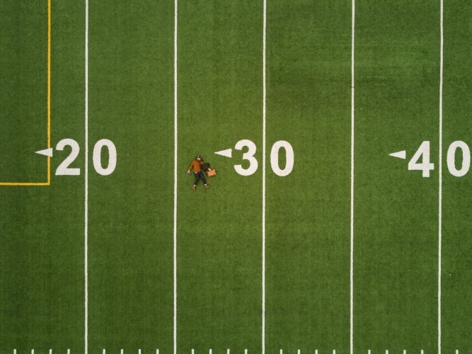 Football field as seen from above with yard lines
