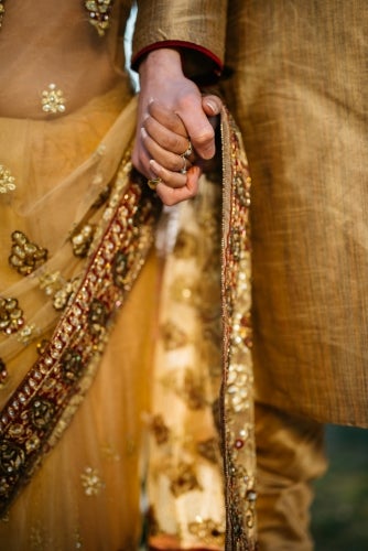 Two people holding hands